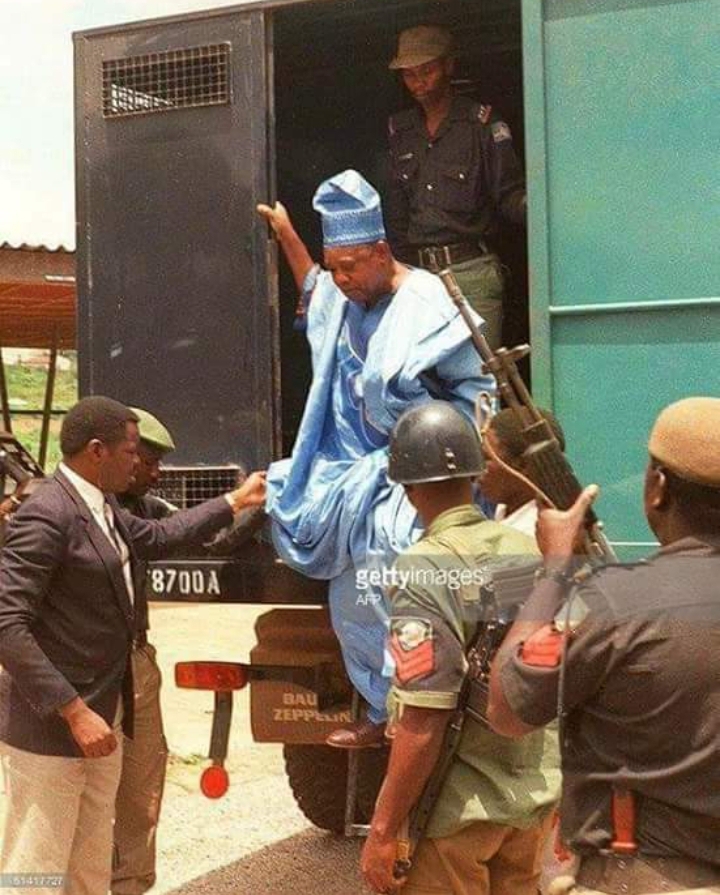 Chief Moshood Abiola driving to court in a Black Maria by the Military Juntas
